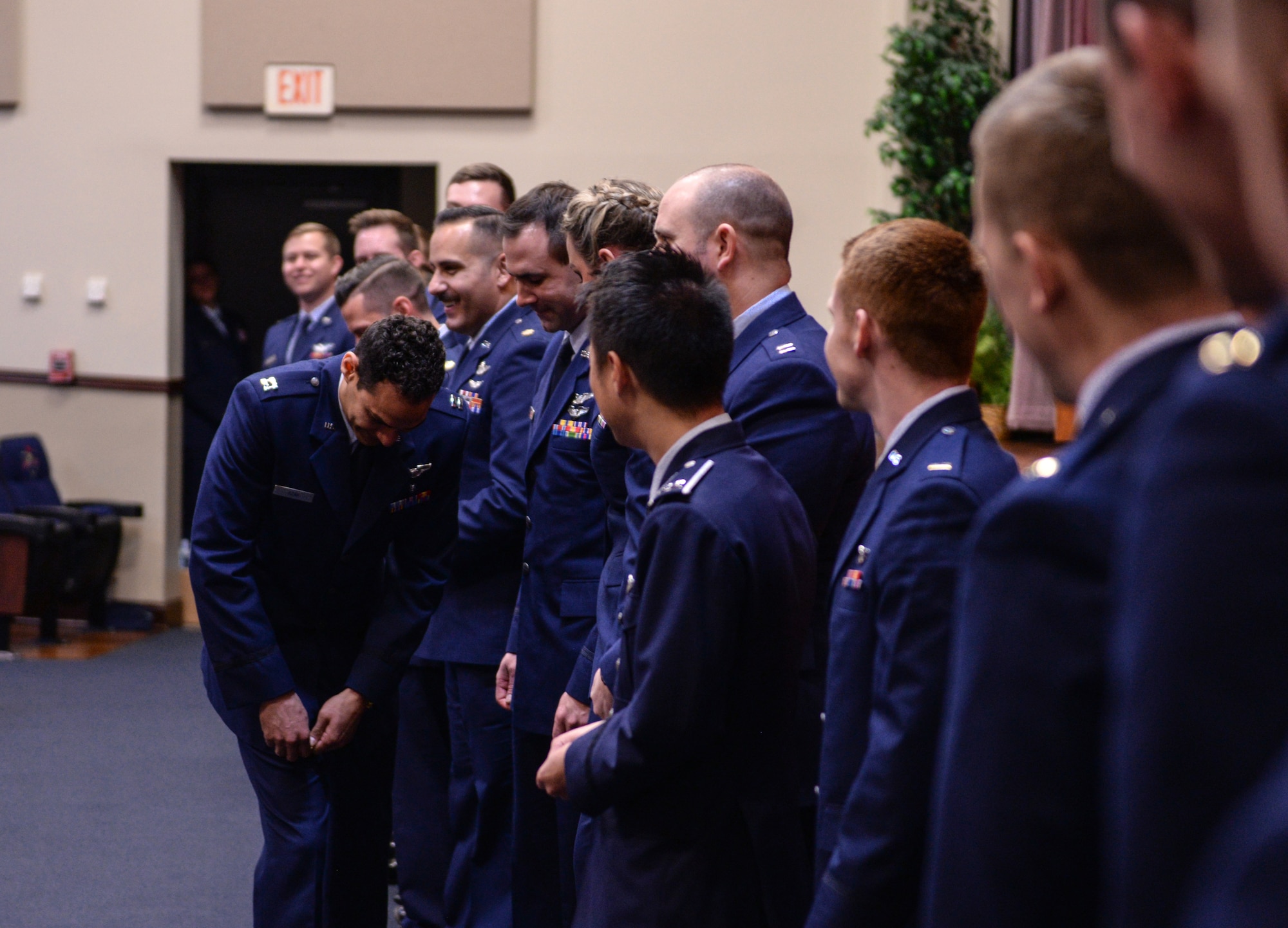 Graduates from Specialized Undergraduate Pilot Training Class 20-08/09 break their “silver wings” at their graduation ceremony Feb. 28, 2020, at Columbus Air Force Base, Mississippi. As tradition and upon graduating pilot training, graduates break their first pair of “silver wings.” (U.S. Air Force photo by Airman Davis Donaldson)