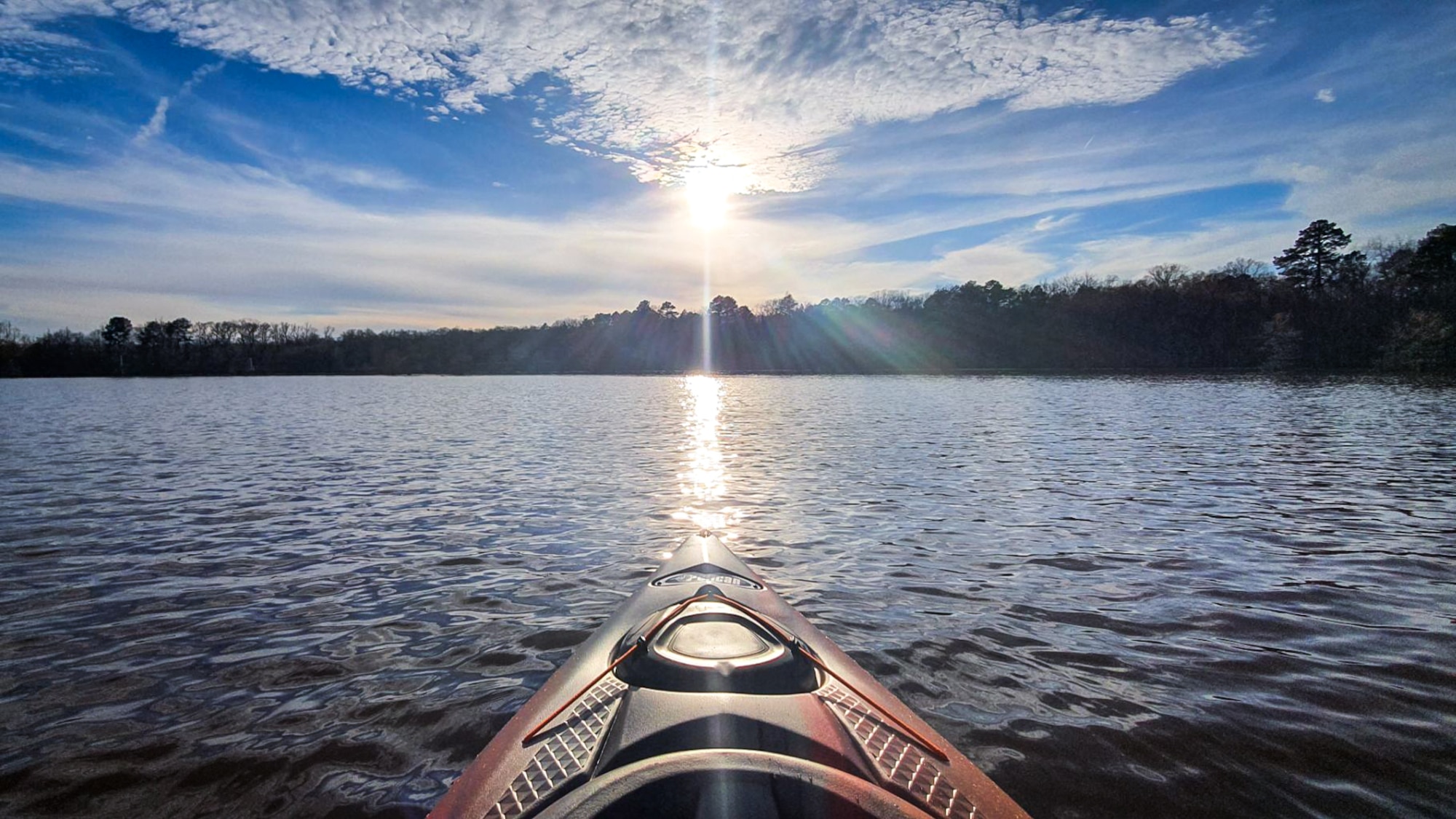 The sun hangs above the horizon at Flag Lake located at Barksdale Air Force Base, La. Feb. 22, 2020. Outdoor Recreation has all of the equipment to allow anyone to rent kayaks, canoes, fishing gear, camping equipment and more.