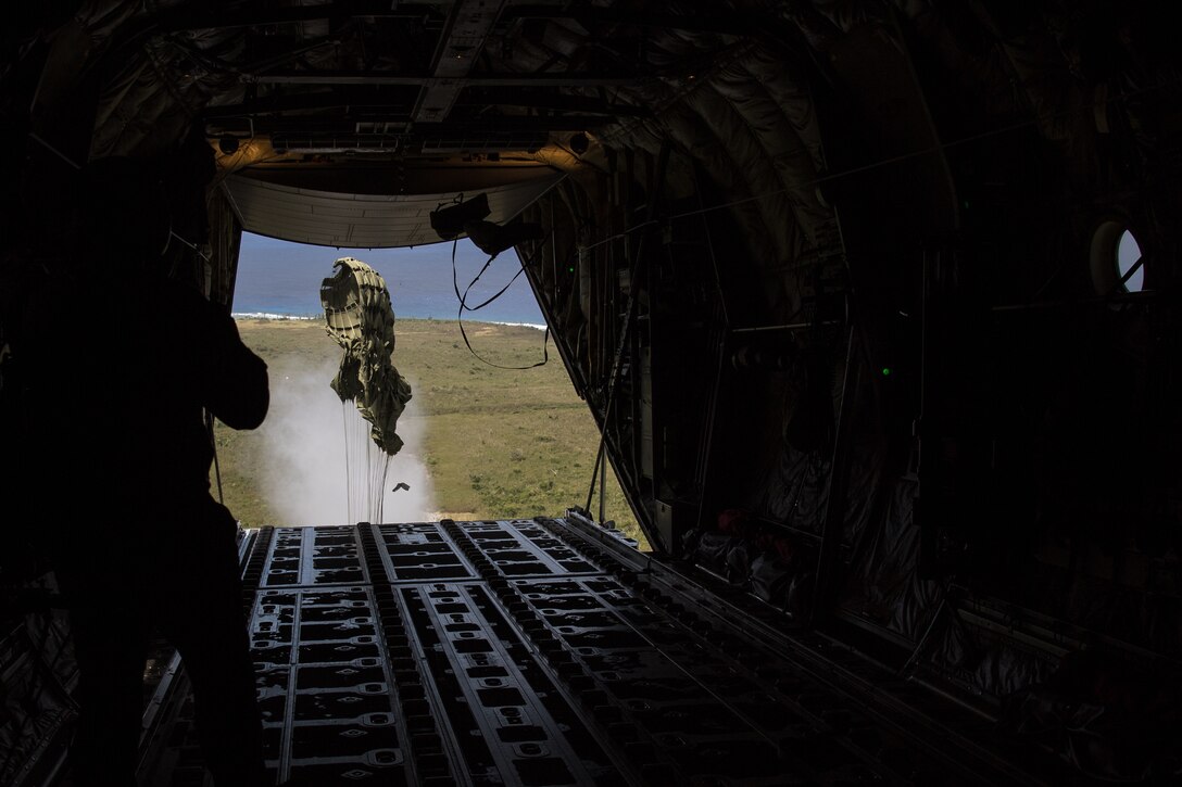 A container delivery system is airdropped from a C-130J Super Hercules over Tinian during Exercise Cope North 20 (CN20), Feb. 24, 2020, Andersen Air Force Base, Guam. CN20 is an annual trilateral field training exercise conducted at Andersen Air Force Base, Guam, and around the Commonwealth of the Northern Mariana Islands (CNMI), Palau and Yap in the Federated States of Micronesia. (U.S. Air Force photo by Senior Airman Gracie Lee)