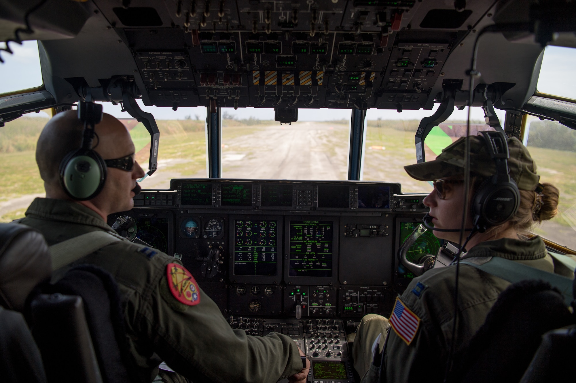 Capt. Jason Rimmer and Capt. Leesa Froelich, pilots assigned to the 815th Airlift Squadron, Keesler Air Force Base, Mississippi, fly a C-130J Hercules for an airdrop of Royal Australian Air Force combat controllers assigned to the 4th Squadron, Bravo flight, during Exercise Cope North 20, Feb. 14, 2020, Andersen Air Force Base, Guam. Cope North 20 is an annual trilateral field training exercise conducted at Andersen Air Force Base, Guam, and around the Commonwealth of the Northern Mariana Islands (CNMI), Palau and Yap in the Federated States of Micronesia. (U.S. Air Force photo by Senior Airman Gracie Lee)