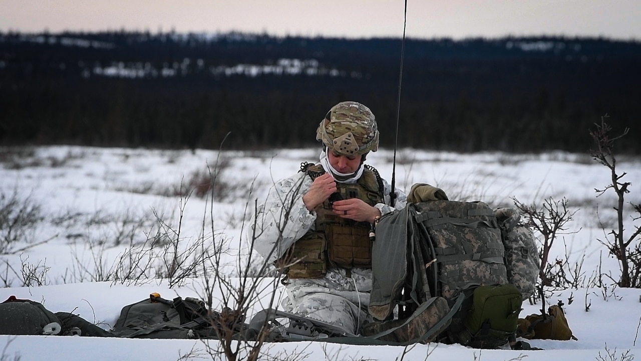A person sits in the snow