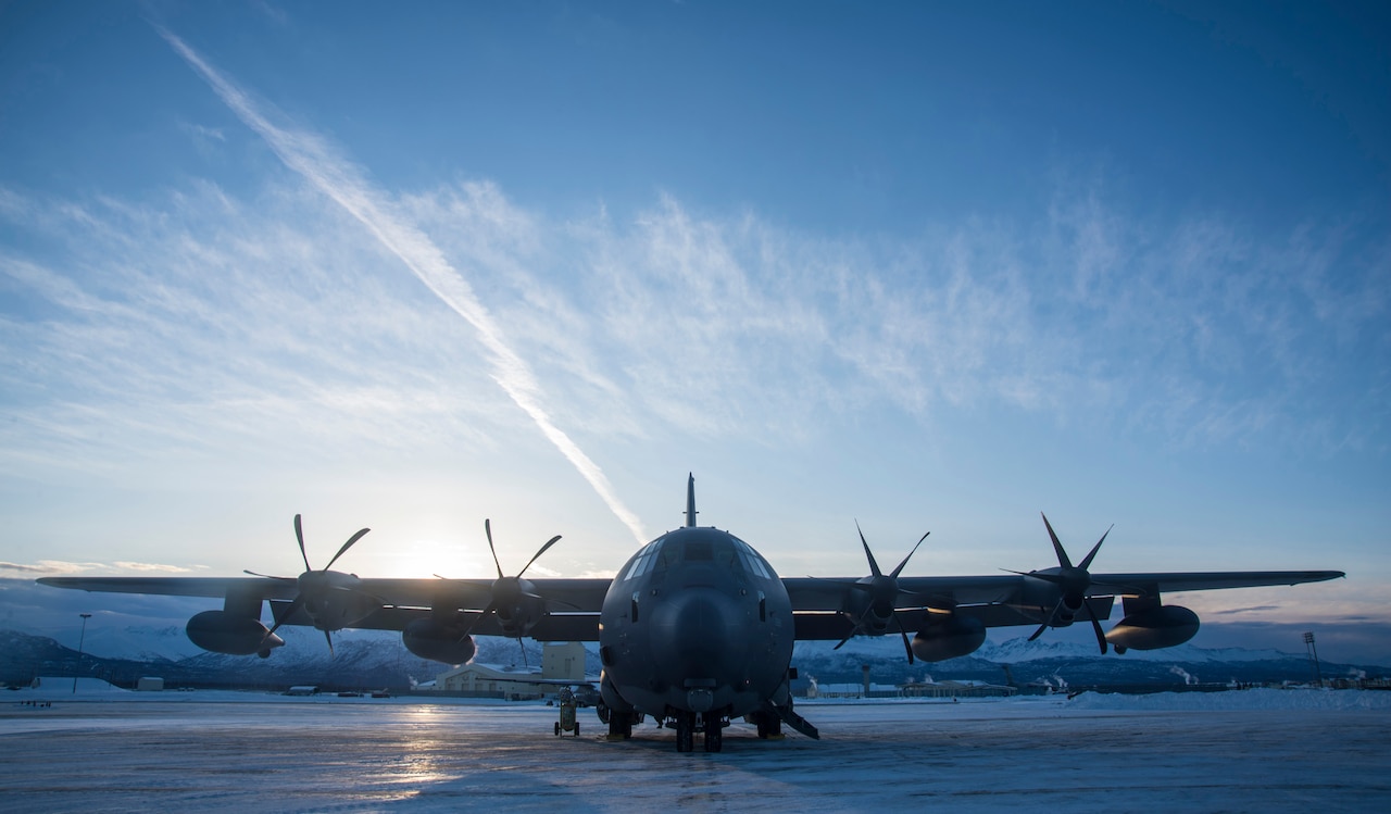 Aircraft sits on icy runway.