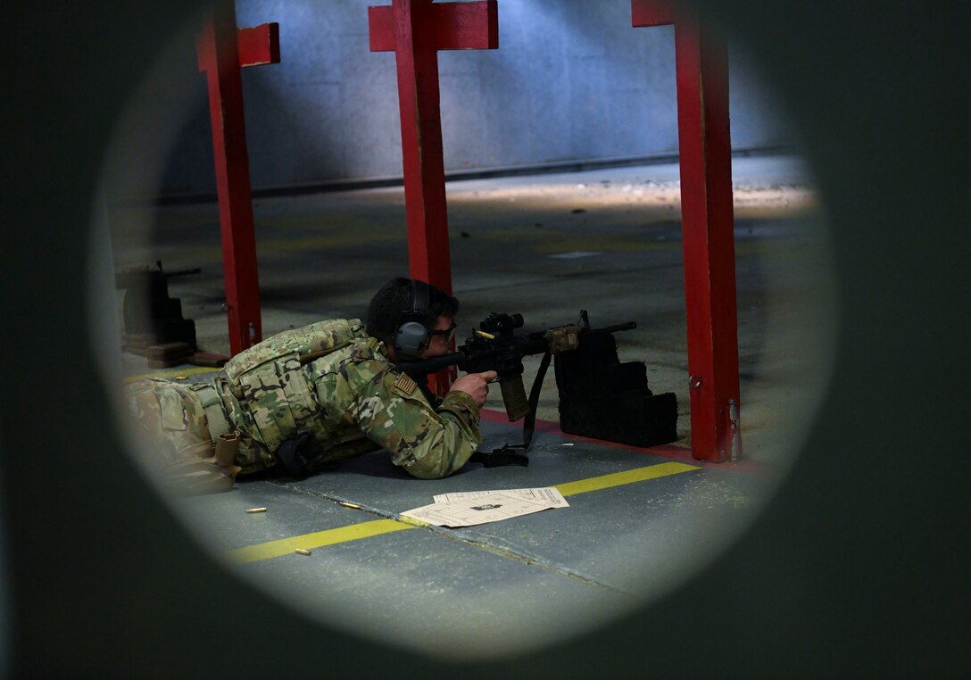 Staff Sgt. Matthew Ratchford, 11th Security Support Squadron military working dog handler, fires an M4 carbine as part of the Defender Challenge 2020 on Joint Base Andrews, Md., Feb. 27, 2020. JBA defenders competed for an opportunity to represent Air Force District of Washington team in the DC2020 in Camp Bullis, San Antonio, Texas. The challenge will focuson the capability, lethality and readiness of each team. (U.S. Air Force photo by Staff Sgt. Andrew Walck)