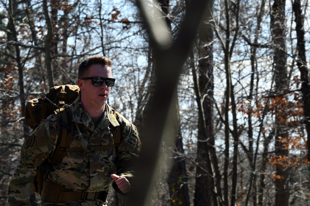 1st Lt. Austin Drake, 11th Security Support Squadron operations officer, leads the ruck-march portion of Defender Challenge 2020 tryouts at Joint Base Andrews, Md., Feb. 27, 2020. Drake, along with other JBA defenders, competed for the right to represent the Air Force District of Washington at DC2020 at Camp Bullis, San Antonio, Texas. (U.S. Air Force photo by Staff Sgt. Jason Huddleston)