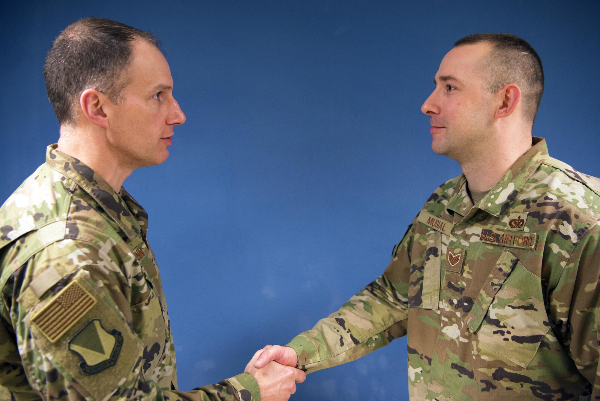 U.S. Air Force Col. Matthew S. Husemann, 86th Airlift Wing vice commander shakes the hand of Staff Sgt. Corey Musial, 86th Civil Engineer Squadron airman dorm leader after Musial received the honor of being named Ramstein’s Airlifter of the Week on Ramstein Air Base, Germany, Feb. 21, 2020. Musial was recognized for managing 67 temporary overflow rooms for Airmen when dorm occupancy remains at peak levels. (U.S. Air Force photo by Senior Airman Noah Coger)