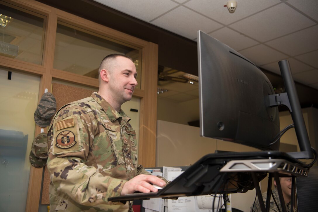 U.S. Air Force Staff Sgt. Corey Musial, 86th Civil Engineer Squadron airman dorm leader, works at his desk at the Kaiserslautern Military Community Dorm Reception Center on Ramstein Air Base, Germany, March 3, 2020. As an ADL, Musial said helping Airmen every day is what helps keep him motivated. (U.S. Air Force photo by Senior Airman Kristof J. Rixmann)