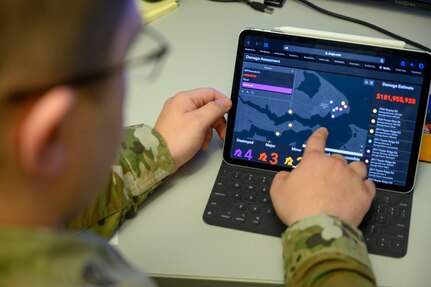 Master Sgt. Brandon Louderback, a 188th CES engineer assistant, Arkansas National Guard, demonstrates Geographic Information System (GIS) surveying capabilities during a training exercise, March 4, 2020, at Ebbing Air National Guard base, Fort Smith, Ark.