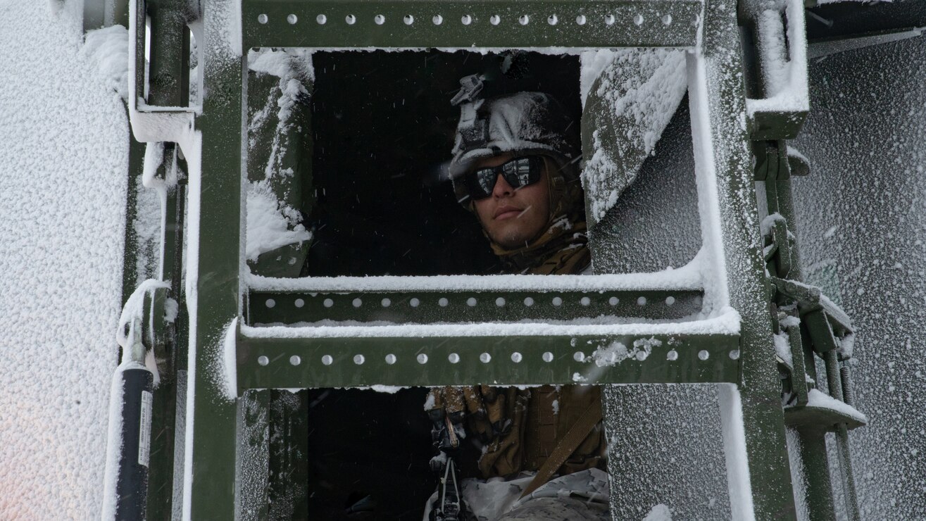 A U.S. Marine rides in a Medium Tactical Vehicle Replacement during a cold-weather training package in preparation of Exercise Cold Response 20, in Bjerkvik, Norway, Feb. 26.