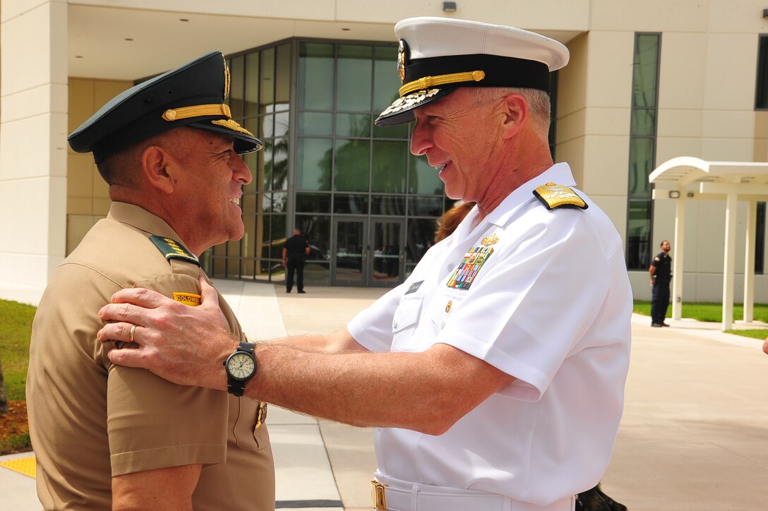 Navy Adm. Craig Faller, the Commander of U.S. Southern Command, greets Colombia's Chief of Defense Maj. Gen. Luis Navarro Jiménez .
