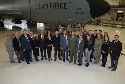 Nine mayors and other delegates from Kosovo in front of a U.S. Air Force KC-135 Statotanker at the 185th Air Refueling Wing in Sioux City, Iowa, Feb. 26, 2020. The group came to Iowa to formalize a sister-city agreement between the city of Gjilian and Sioux City as an outgrowth of the National Guard State Partnership Program.