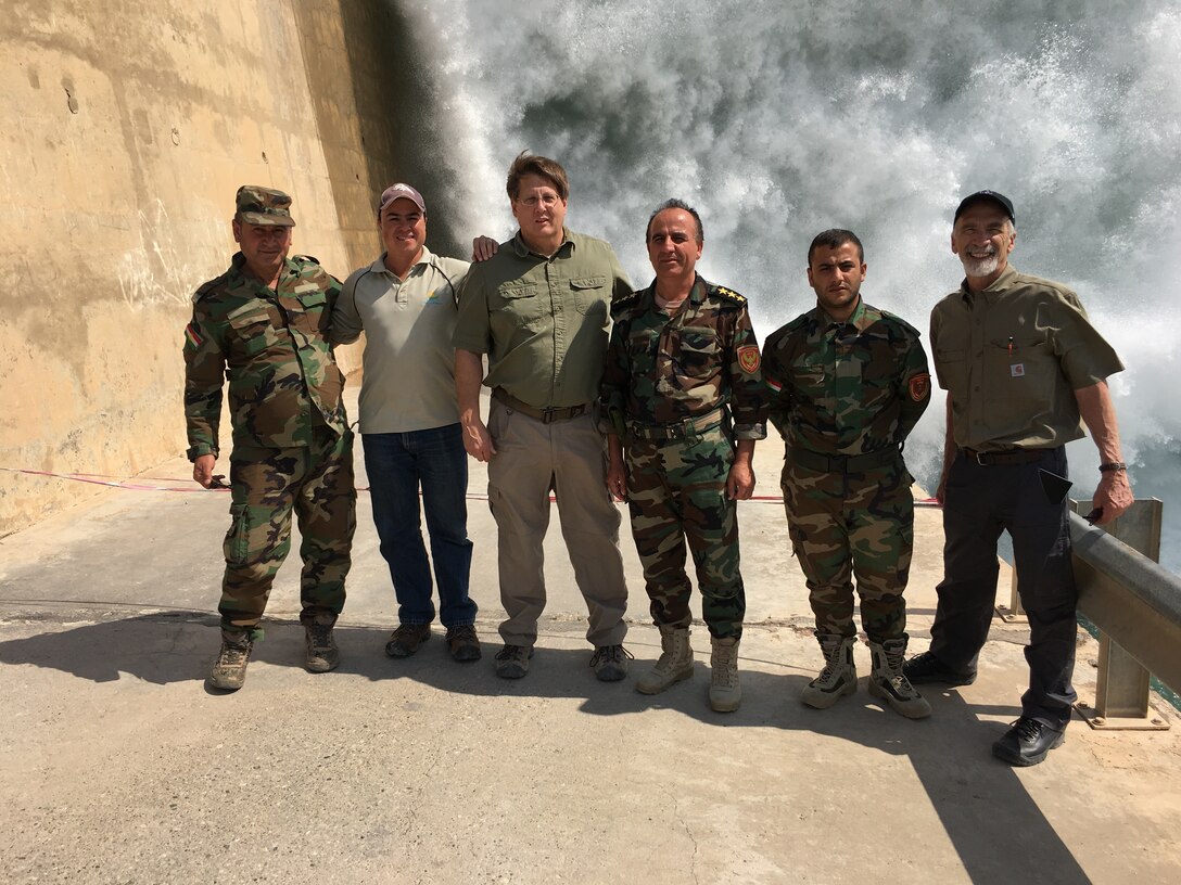 The Scientific / Technical Award of Excellence recognized the Mosul Dam Bottom Outlet Plunge Pool, a team effort led by Mr. Mike Phillips from IWR’s Risk Management Center (RMC).  Shown here are Mike Phillips and Bill Empson with Sal Todaro and the Iraqis at the Mosul Dam, Iraq (2019)