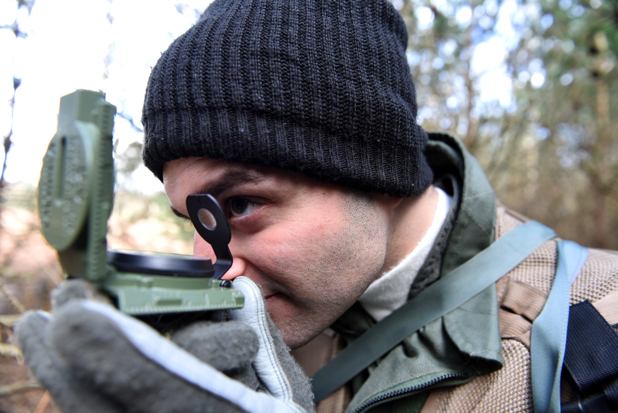 A 48th Fighter Wing Airman uses a compass during a Survival, Evasion, Resistance, and Escape training course at Stanford Training Area near Thetford, England, March 4, 2020. The training course teaches Airmen the skills needed to escape and evade behind enemy lines. (U.S. Air Force photo by Airman 1st Class Rhonda Smith)