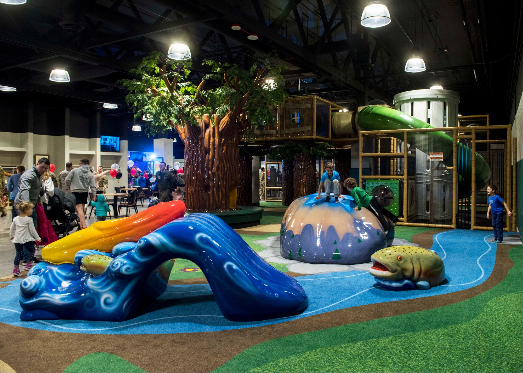 U.S. Air Force Airmen and their families enjoy the indoor playground inside the Alder House, Fairchild’s newest community center, during its grand opening at Fairchild Air Force Base, Washington, March 2, 2020. The Alder House opened its doors as a replacement to its previous community center, The Funspot, which closed October 2016. (U.S. Air Force photo by Senior Airman Lawrence Sena)