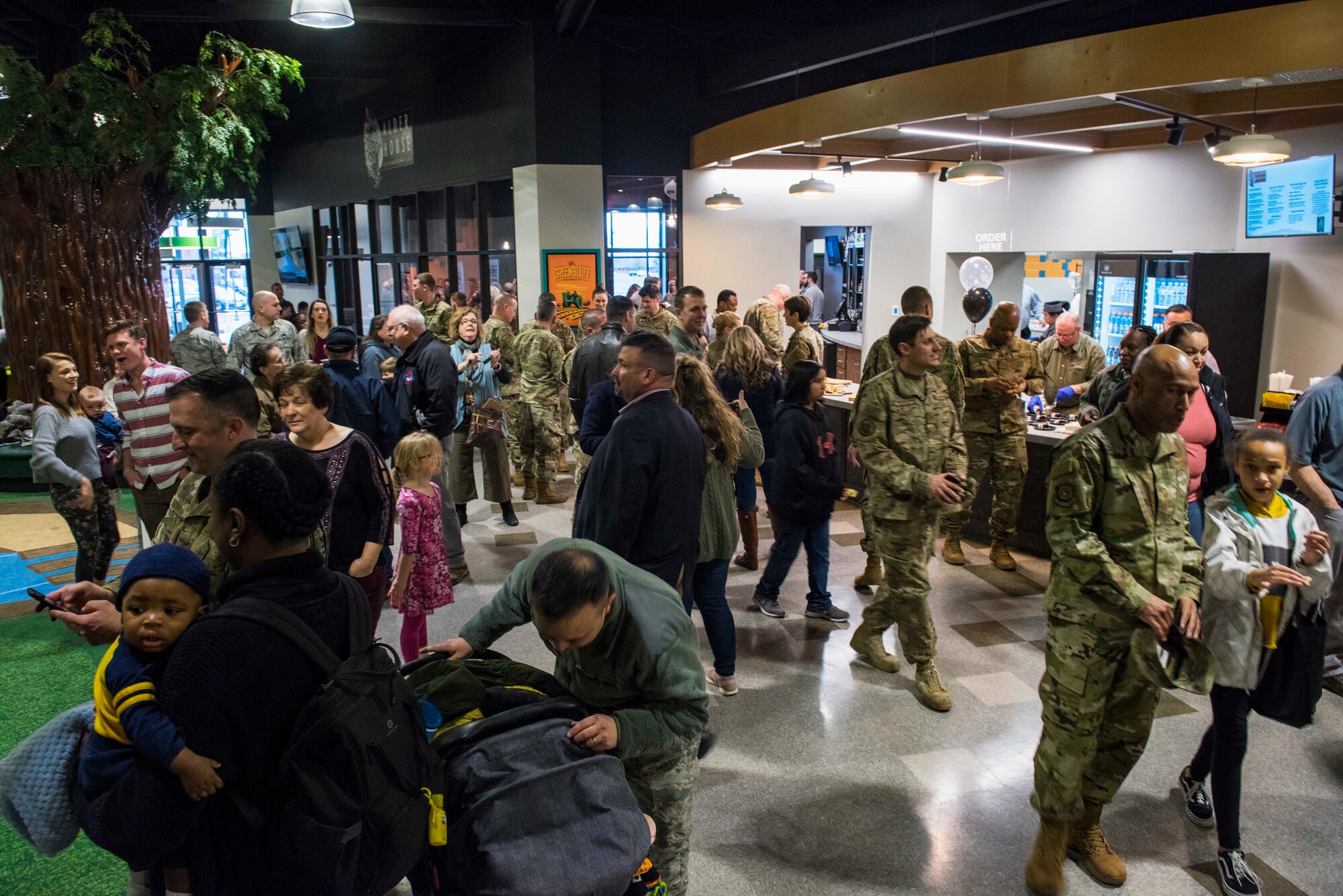 U.S. Air Force Airmen and their families explore inside the Alder House, Fairchild’s newest community center, during its grand opening at Fairchild Air Force Base, Washington, March 2, 2020. The Alder House opened its doors as a replacement to its previous community center, The Funspot, which closed October 2016.  (U.S. Air Force photo by Senior Airman Lawrence Sena)