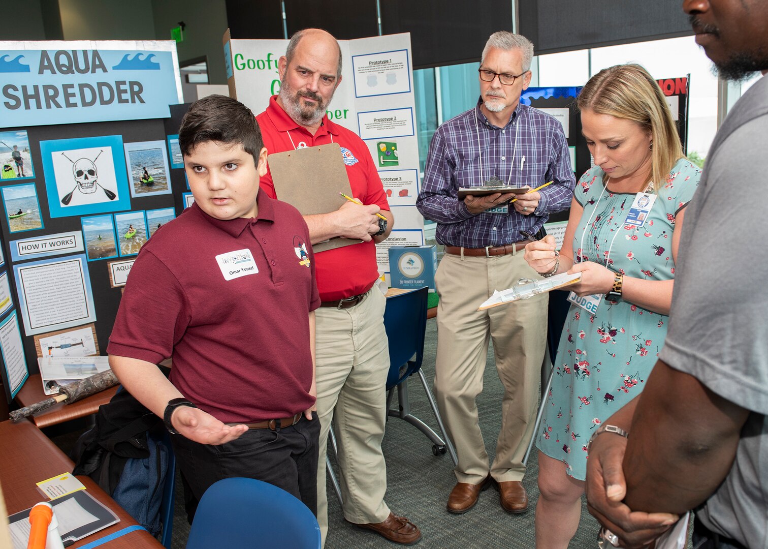 Scientists and engineers from Naval Surface Warfare Center Panama City Division (NSWC PCD) and personnel from other organizations served as judges for this year's Invention Convention. Darryl Updegrove, back right, serves as a branch head at NSWC PCD.