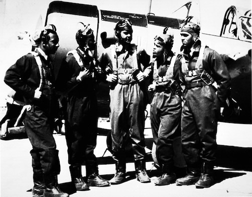 In 1941 the first group of black cadets to earn their wings at Tuskegee Army Air Field gather alongside a Vultee BT-13 trainer. Benjamin O. Davis Jr. (middle) became the first black general in the U.S. Air Force in 1954. (From the Smithsonian Institution, ID #99-15437)