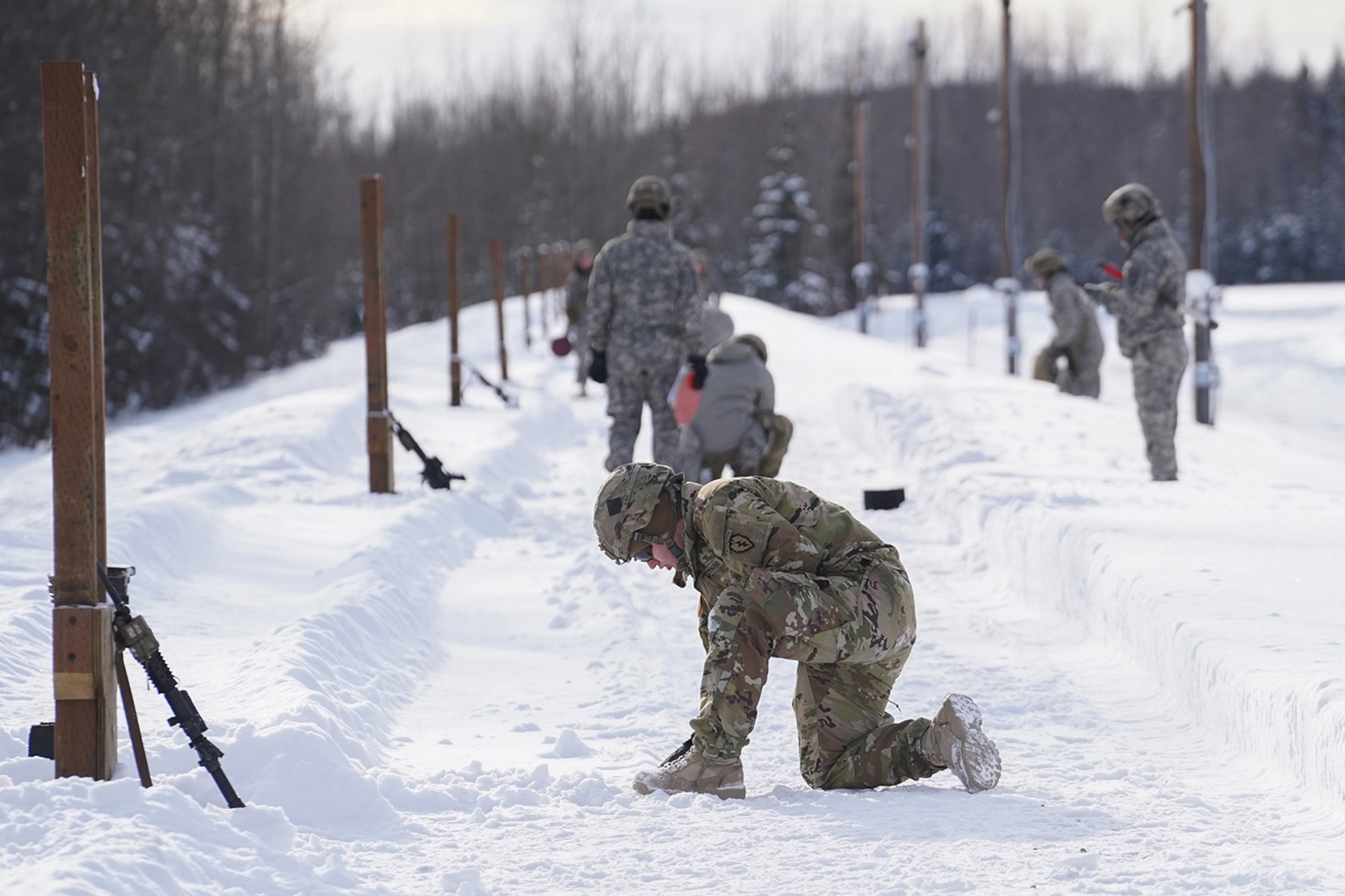 Paratroopers assigned to 1st Battalion, 501st Parachute Infantry Regiment, 4th Infantry Brigade Combat Team (Airborne), 25th Infantry Division, U.S. Army Alaska, qualify with M-4 carbines on Joint Base Elmendorf-Richardson, Alaska, March 3, 2020.