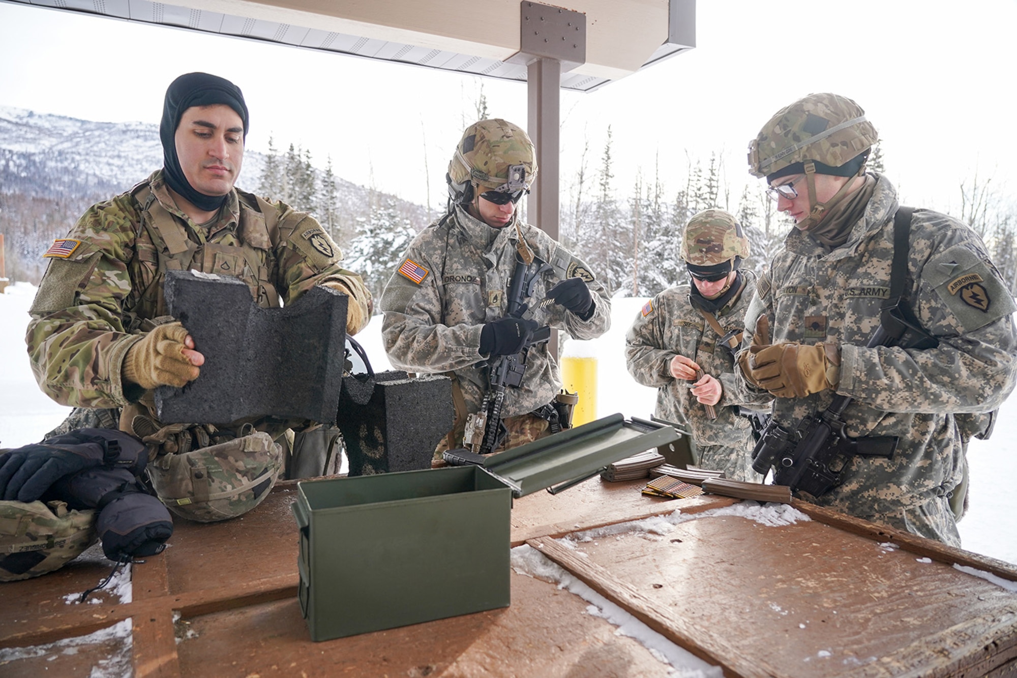 Paratroopers assigned to 1st Battalion, 501st Parachute Infantry Regiment, 4th Infantry Brigade Combat Team (Airborne), 25th Infantry Division, U.S. Army Alaska, qualify with M-4 carbines on Joint Base Elmendorf-Richardson, Alaska, March 3, 2020.