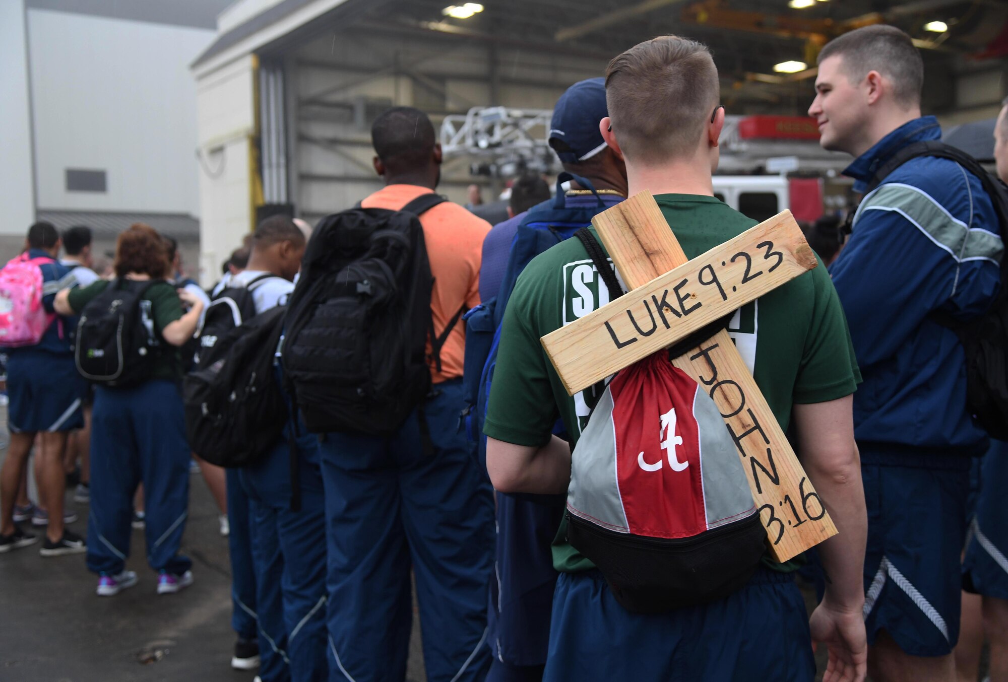 Keesler personnel carry personalized backpacks as they participate in the Dragons March Fourth ruck march on the flightline at Keesler Air Force Base, Mississippi, March 4, 2020. Keesler personnel carried backpacks during the three-mile walk which symbolized the weight one carries through life. (U.S. Air Force photo by Kemberly Groue)