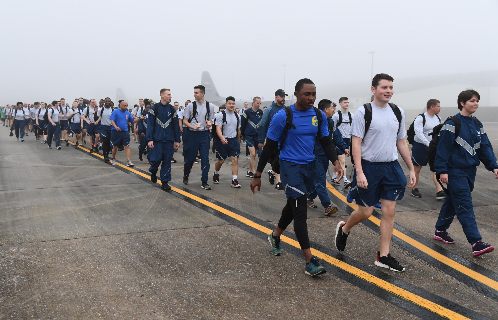 Keesler personnel participate in the Dragons March Fourth ruck march on the flightline at Keesler Air Force Base, Mississippi, March 4, 2020. Keesler personnel carried backpacks during the three-mile walk which symbolized the weight one carries through life. (U.S. Air Force photo by Kemberly Groue)
