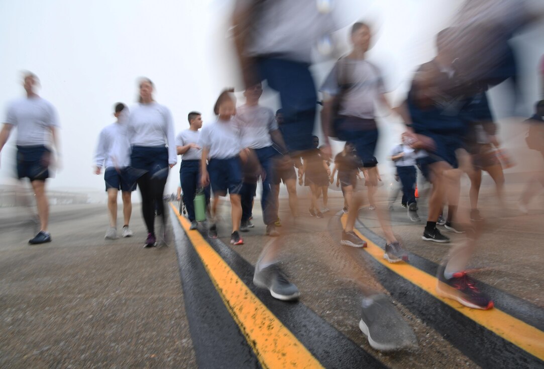 Keesler personnel participate in the Dragons March Fourth ruck march on the flightline at Keesler Air Force Base, Mississippi, March 4, 2020. Keesler personnel carried backpacks during the three-mile walk which symbolized the weight one carries through life. (U.S. Air Force photo by Kemberly Groue)
