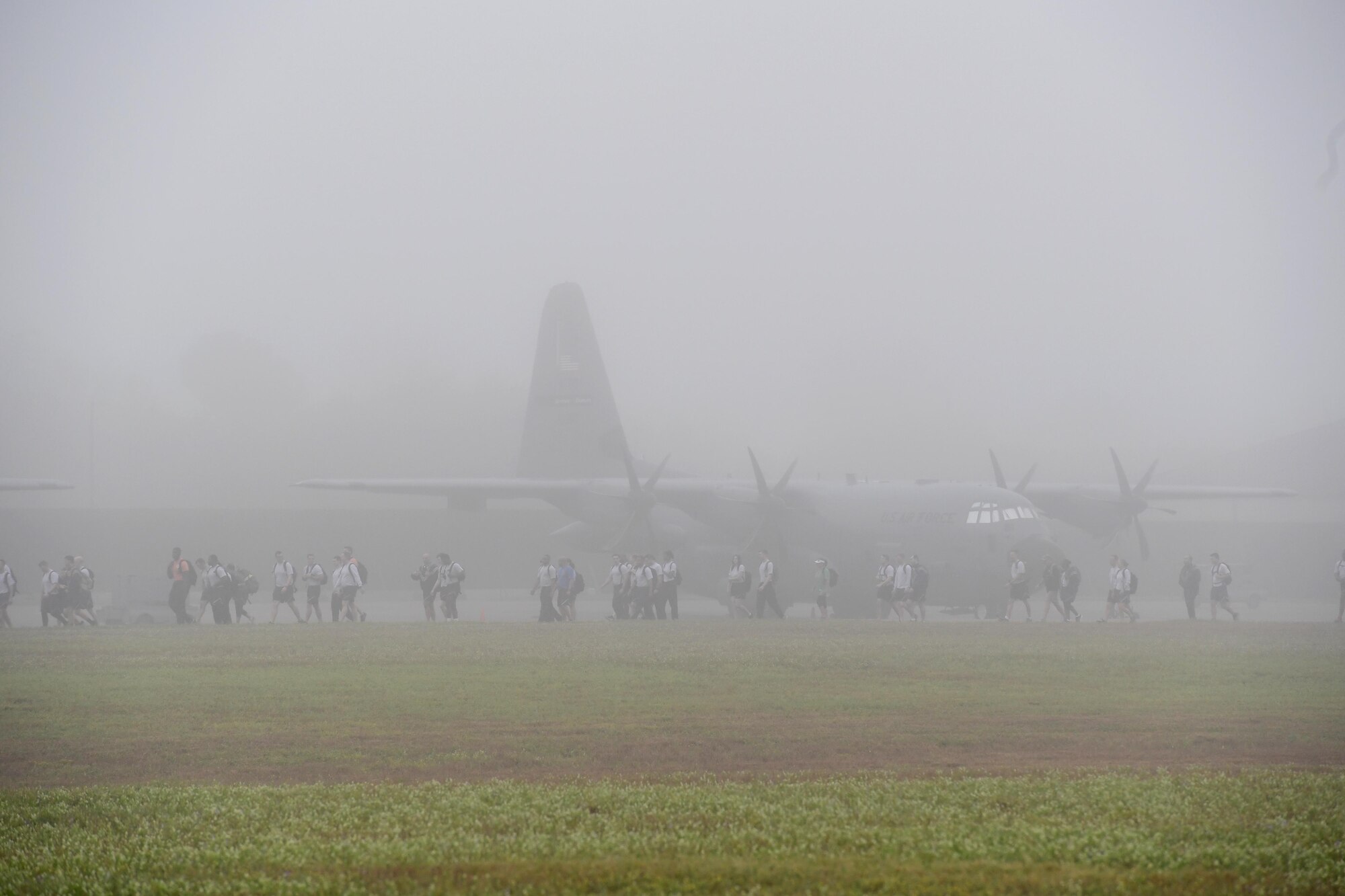 Keesler personnel participate in the Dragons March Fourth ruck march on the flightline at Keesler Air Force Base, Mississippi, March 4, 2020. Keesler personnel carried backpacks during the three-mile walk which symbolized the weight one carries through life. (U.S. Air Force photo by Kemberly Groue)