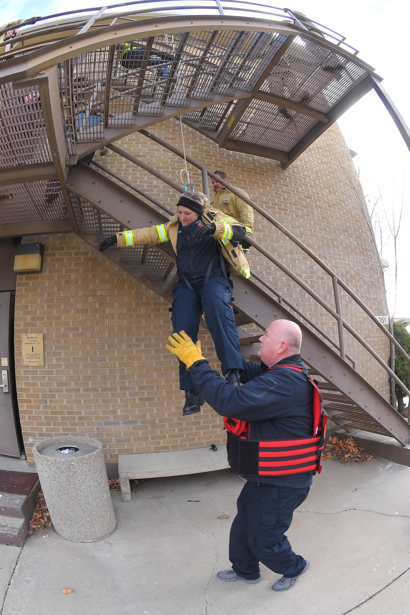 First responders receive instruction on patient extraction with a rope during a Rescue Task Force exercise Feb. 12, 2020, at Hill Air Force Base, Utah. The RTF is a tactic used during active shooter/hostile events and consists of “task forces” or integrated teams of security forces defenders and fire and emergency medical services responders working together to provide medical care to victims during an incident much faster. (U.S. Air Force photo by Todd Cromar)