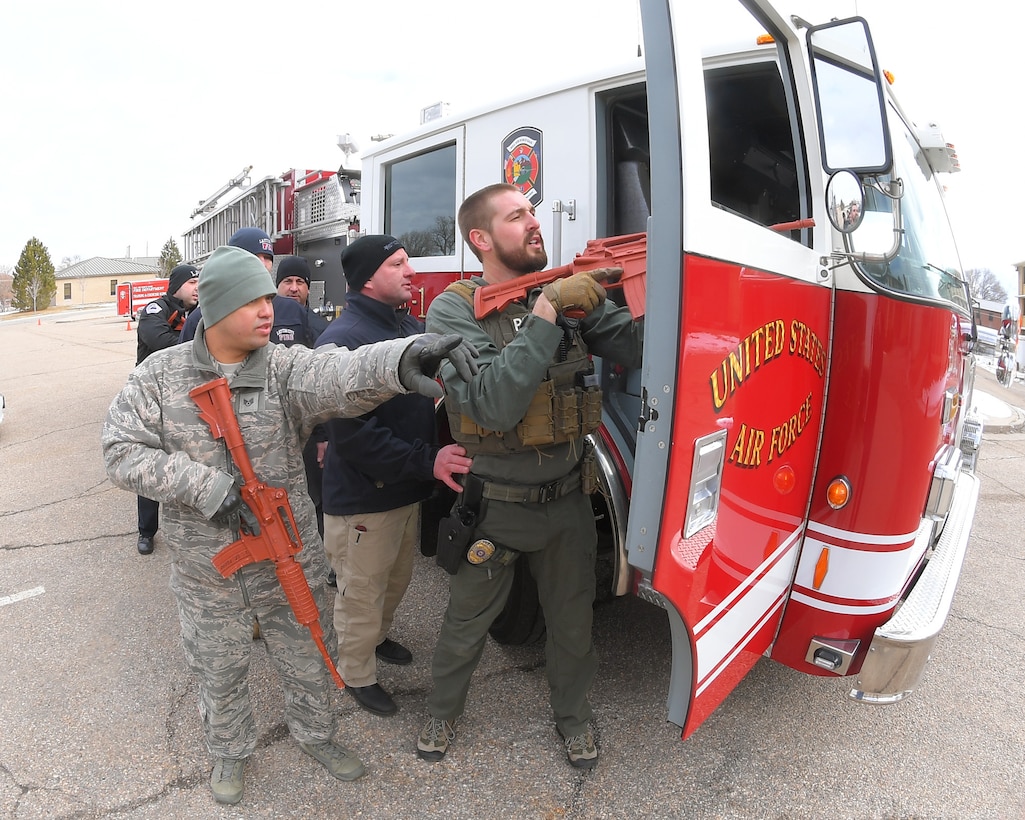 First responders moving with vehicle cover during a Rescue Task Force exercise Feb. 12, 2020, at Hill Air Force Base, Utah. The RTF is a tactic used during active shooter/hostile events and consists of “task forces” or integrated teams of security forces defenders and fire and emergency medical services responders working together to provide medical care to victims during an incident much faster. (U.S. Air Force photo by Todd Cromar)