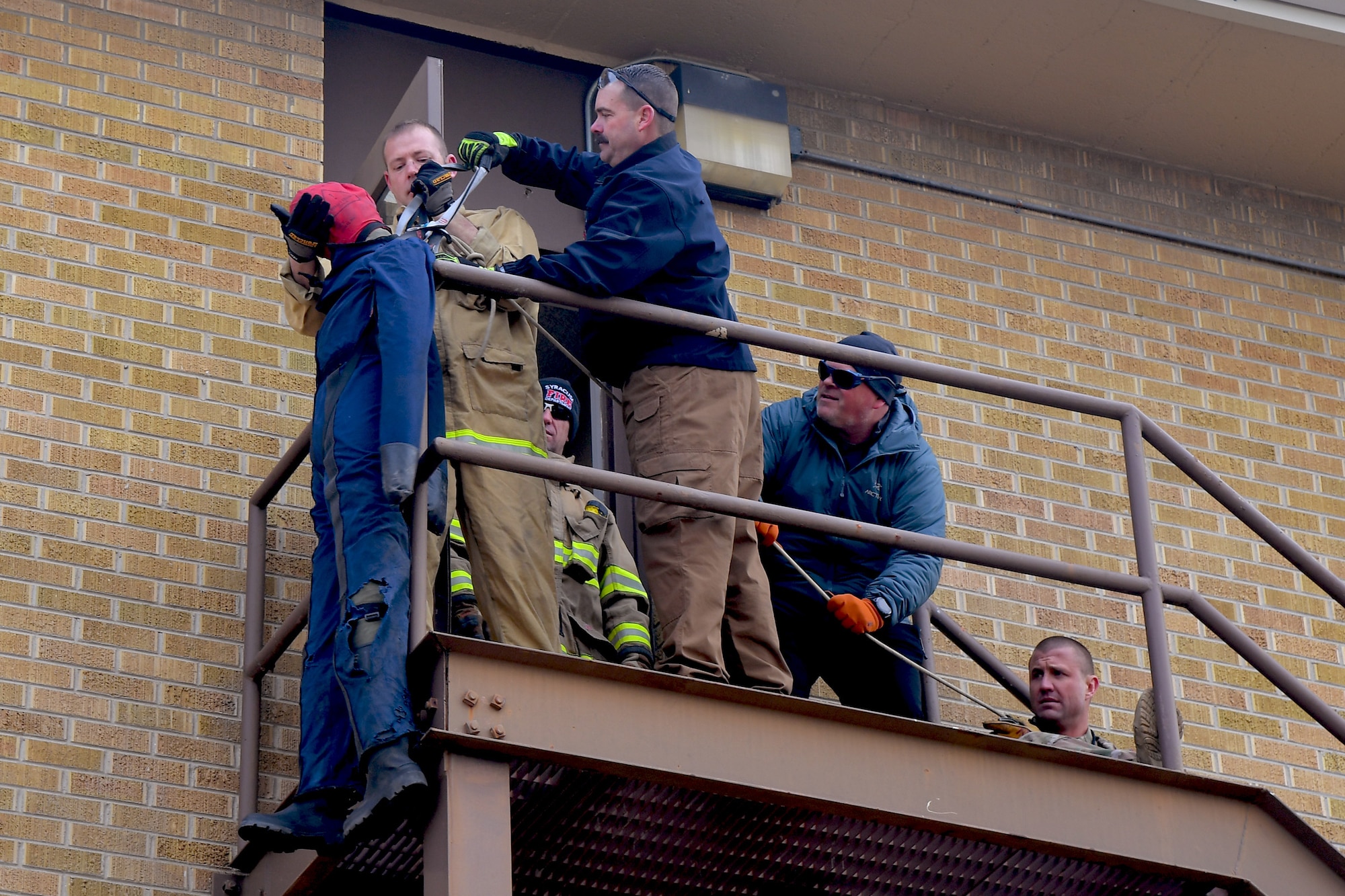 First responders receive instruction on patient extraction with a rope during a Rescue Task Force exercise Feb. 12, 2020, at Hill Air Force Base, Utah. The RTF is a tactic used during active shooter/hostile events and consists of “task forces” or integrated teams of security forces defenders and fire and emergency medical services responders working together to provide medical care to victims during an incident much faster. (U.S. Air Force photo by Todd Cromar)