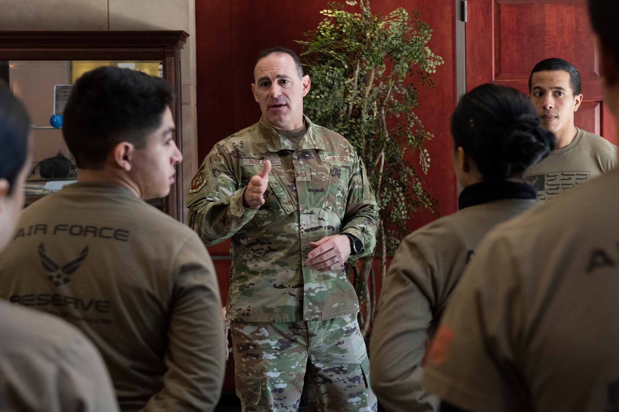 A senior enlisted member speaks to a group.