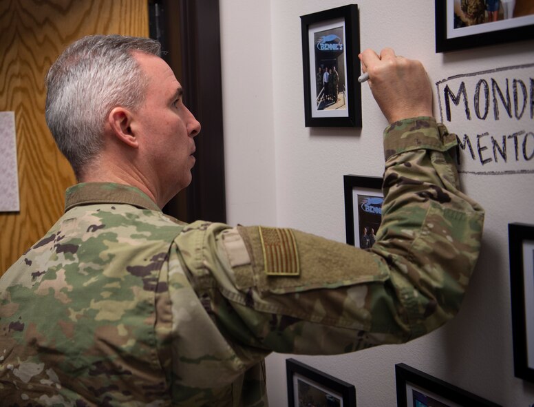 Maj. Gen. Stephen Whiting, Headquarters United States Space Force deputy commander, signs the “Monday Mentors” wall at Bennie’s at Schriever Air Force Base, Colorado, March 3, 2020. Other mentors who attended the reoccurring session and signed the wall include Neil deGrasse Tyson and retired Col. Nicole Malachowski. (U.S. Air Force photo by Airman 1st Class Jonathan Whitely)