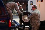 Members of the 118th Civil Engineer Squadron, Tennessee Air National Guard, load supplies onto a truck March 3, 2020, at Berry Field Air National Base, Nashville, Tennessee. Several 118th CES Airmen mobilized on just a few hours notice to answer a call to power a water treatment facility in Gainesboro, Tennessee, following severe infrastructure damage from the Middle Tennessee tornados.