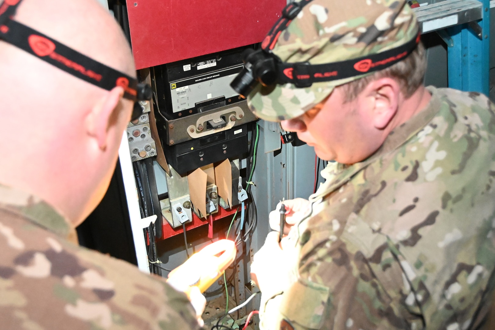 Members of the 118th Civil Engineer Squadron, Tennessee Air National Guard, examine wiring at a water treatment facility March 3, 2020, in Gainesboro, Tennessee. Several 118th CES Airmen mobilized on just a few hours notice to answer a call to power the water treatment facility following severe infrastructure damage from the Middle Tennessee tornados.
