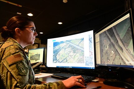 An Airman from the 118th Intelligence, Surveillance, and Reconnaissance Group, Tennessee Air National Guard, examines images of tornado damage across Tennessee March 4, 2020, at Berry Field Air National Guard Base, Nashville, Tennessee. Several Airmen from the 118th ISRG analyzed imagery from commercial satellites and open source websites to determine extent and location of damage caused by the Middle Tennessee tornados.