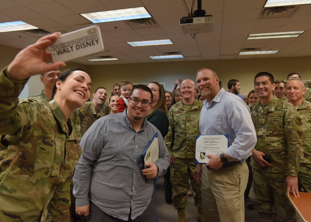 Brig. Gen. Alice Trevino, Air Force Installation Contracting Center commander, takes a selfie with members of the 82nd Contracting Squadron at an all-call at Sheppard Air Force Base, Texas, March 4, 2020. During the all-call, Trevino encouraged members to embrace change and create realize how much impact their innovative ideas had on the U.S. Air Force as a whole. She also recognized a few members of the 82nd CONS for their hard work and dedication. (U.S. Air Force photo by Senior Airman Ilyana A. Escalona)