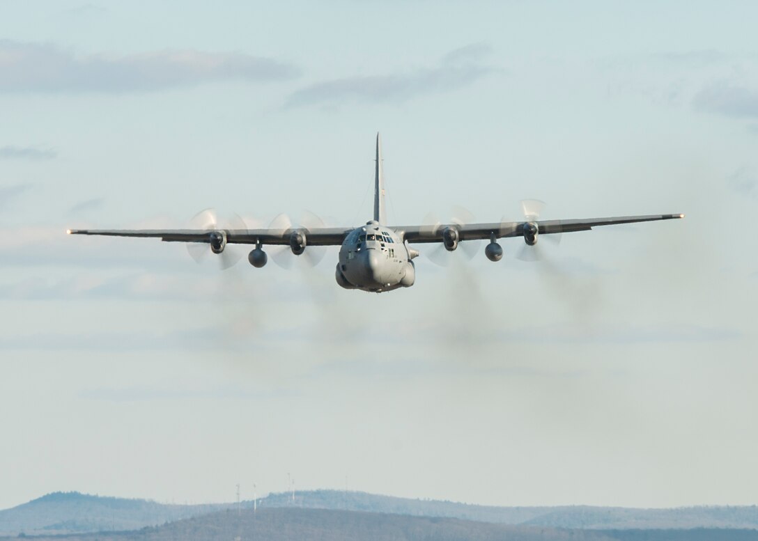 A C-130H Hercules assigned to the 103rd Airlift Wing flies over western Massachusetts, Jan. 15, 2020. Aircrews from the 103rd flew a two-ship formation and conducted airdrops with heavy pallets and container delivery systems, training key tactical airlift capabilities. (U.S. Air National Guard photo by Staff Sgt. Steven Tucker)
