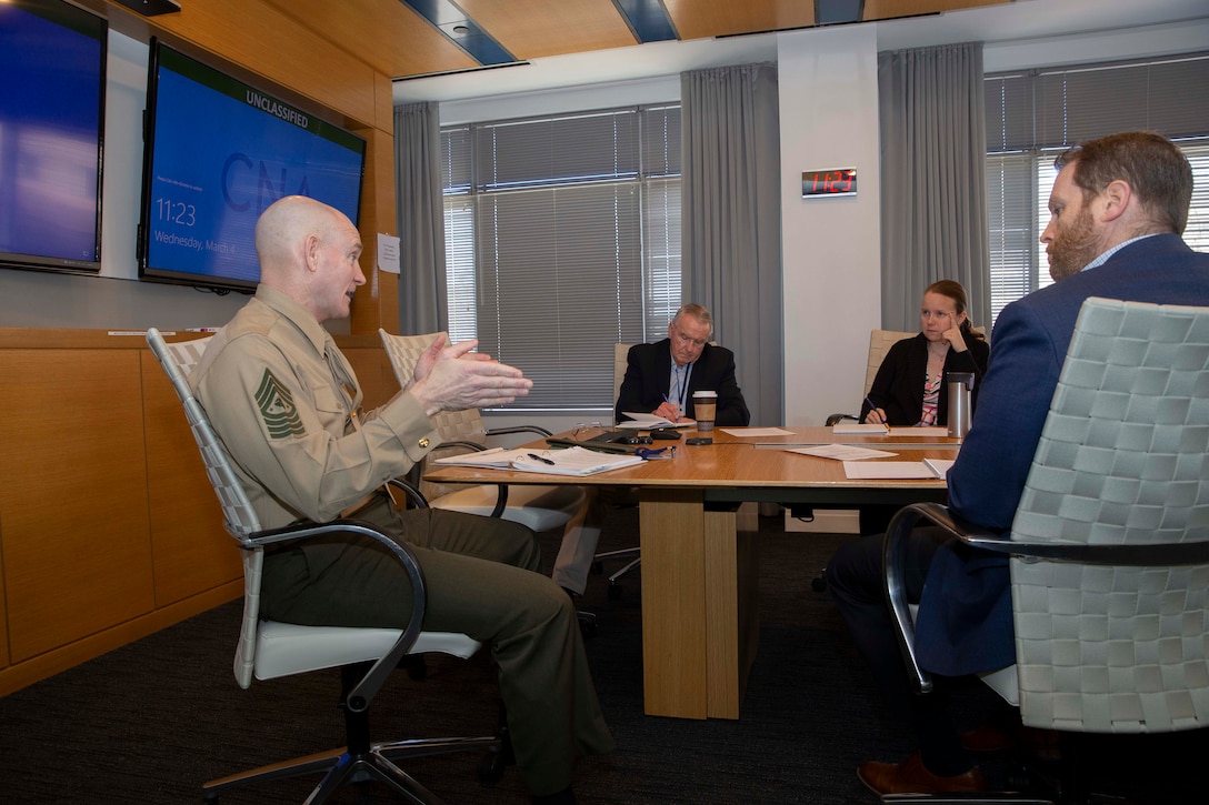 U.S. Marine Sgt. Maj. Troy E. Black, the 19th sergeant major of the Marine Corps meets with professionals from the Center of Naval Analysis and Solutions (CNA) in Arlington, V.A., March 4, 2020. Sgt. Maj. Black visited the CNA staff to thank them for their assistance in developing analytics aimed at improving Talent Development, Health, Wellness, and Fitness, and Personal Professional Education opportunities for Marines and Sailors.  (U.S Marine Corps photo by Sgt. Victoria Ross)
