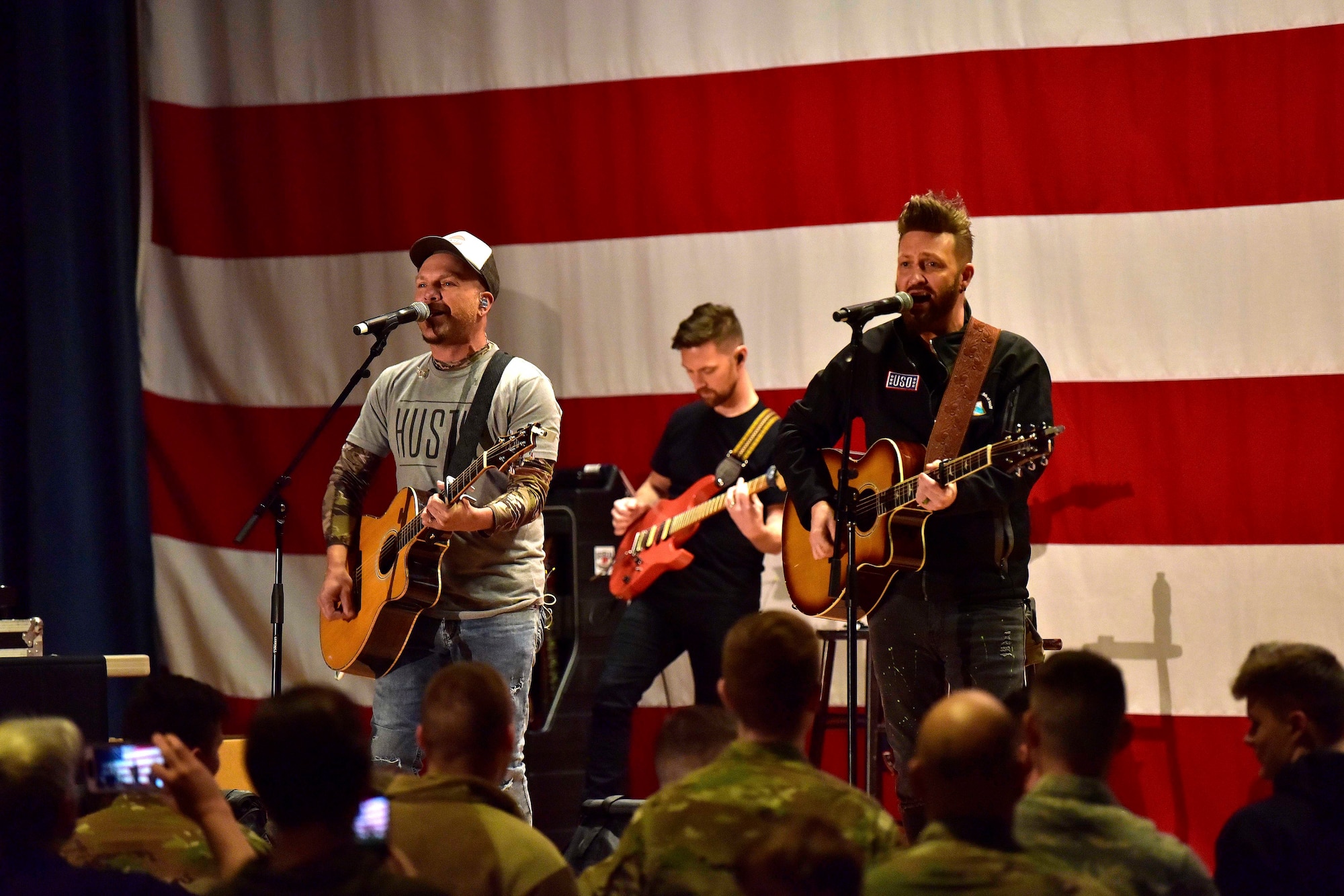 Country music duo LOCASH performs at a United Service Organizations show on Eielson Air Force Base Alaska, March 2, 2020. The USO tour featured other entertainers including Matt Walsh, an American comedian, Brad Morris, a film writer, Scot Armstrong, an American screenwriter, Ilima-Lei Macfarlane, Bellator Mixed Martial Arts Women’s Flyweight World Champion, and DJ J.Dayz. (U.S. Air Force photo by Senior Airman Beaux Hebert)