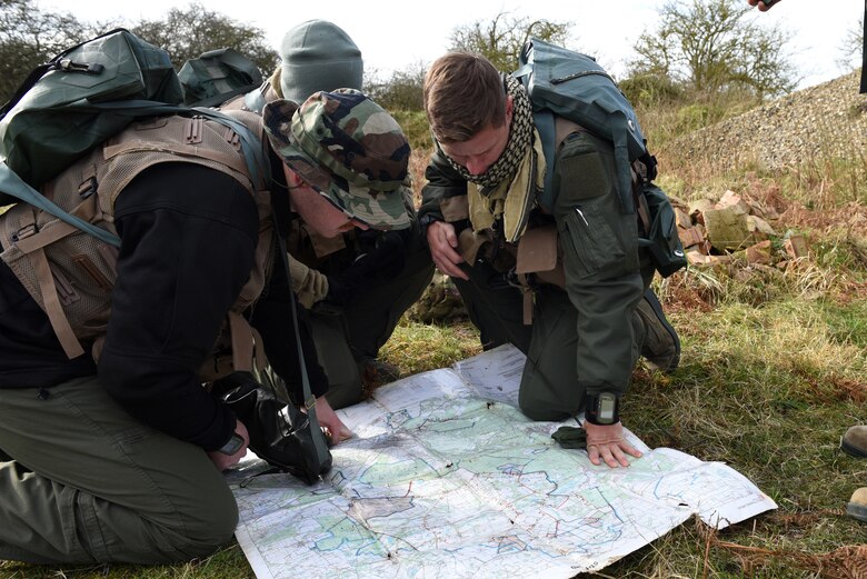 A 48th Fighter Wing Airman applies camouflage face paint during a Survival, Evasion, Resistance, and Escape training course at Stanford Training Area near Thetford, England, March 4, 2020. Camouflage face paint allows class participants to blend into their surroundings which is critical when evading capture. (U.S. Air Force photo by Airman 1st Class Rhonda Smith)