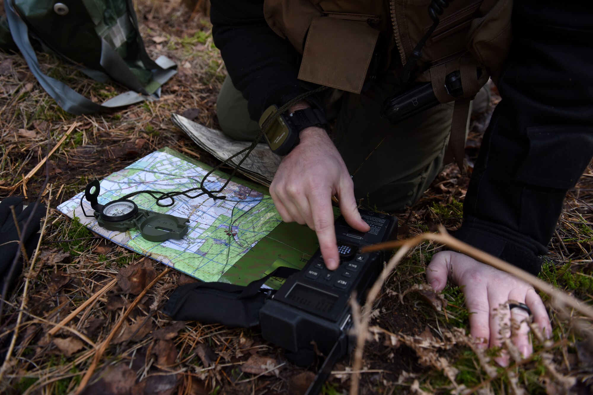 A 48th Fighter Wing Airman searches for a location during a Survival, Evasion, Resistance, and Escape training course at Stanford Training Area near Thetford, England, March 4, 2020. The course trained aircrew personnel on how to use various tools and equipment to aid rescue and recovery efforts. (U.S. Air Force photo by Airman 1st Class Rhonda Smith)