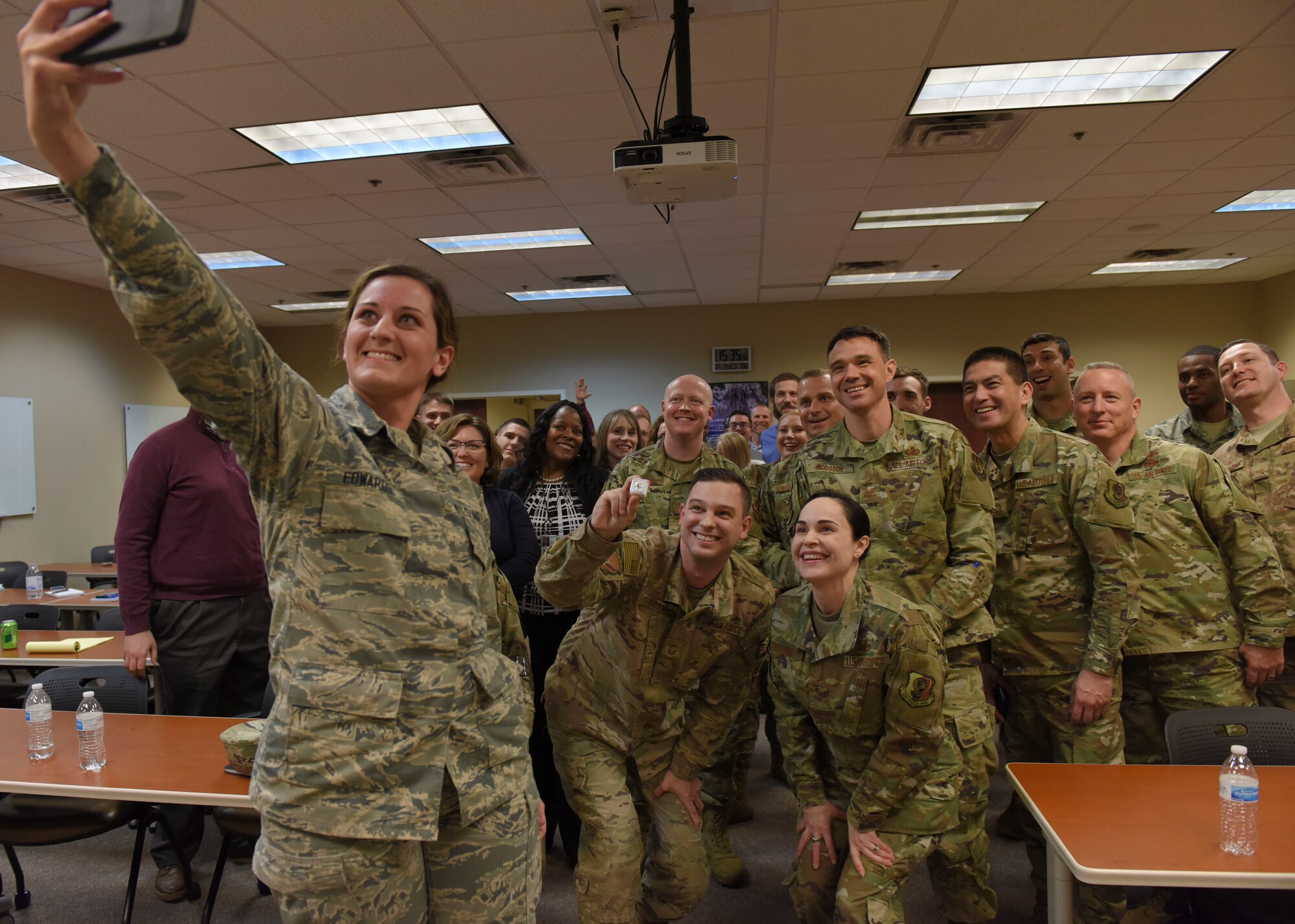 Brig. Gen. Alice Trevino, Air Force Installation Contracting Center commander, poses for a selfie with members of the 82nd Contracting Squadron at an all-call at Sheppard Air Force Base, Texas, March 4, 2020. During the all-call, Trevino encouraged members to embrace change and create realize how much impact their innovative ideas had on the U.S. Air Force as a whole. She also recognized a few members of the 82nd CONS for their hard work and dedication. (U.S. Air Force photo by Senior Airman Ilyana A. Escalona)
