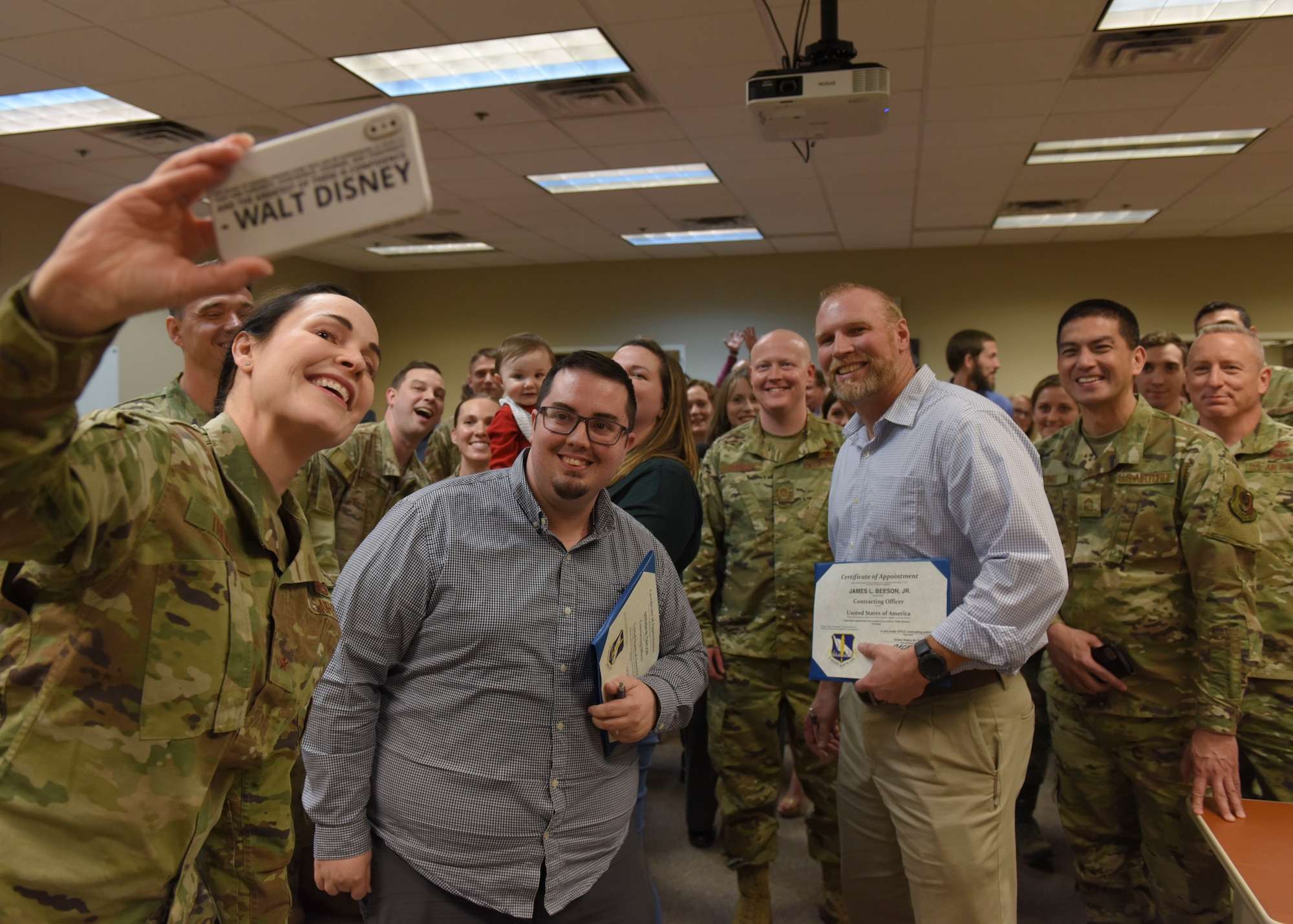 Brig. Gen. Alice Trevino, Air Force Installation Contracting Center commander, takes a selfie with members of the 82nd Contracting Squadron at an all-call at Sheppard Air Force Base, Texas, March 4, 2020. During the all-call, Trevino encouraged members to embrace change and create realize how much impact their innovative ideas had on the U.S. Air Force as a whole. She also recognized a few members of the 82nd CONS for their hard work and dedication. (U.S. Air Force photo by Senior Airman Ilyana A. Escalona)