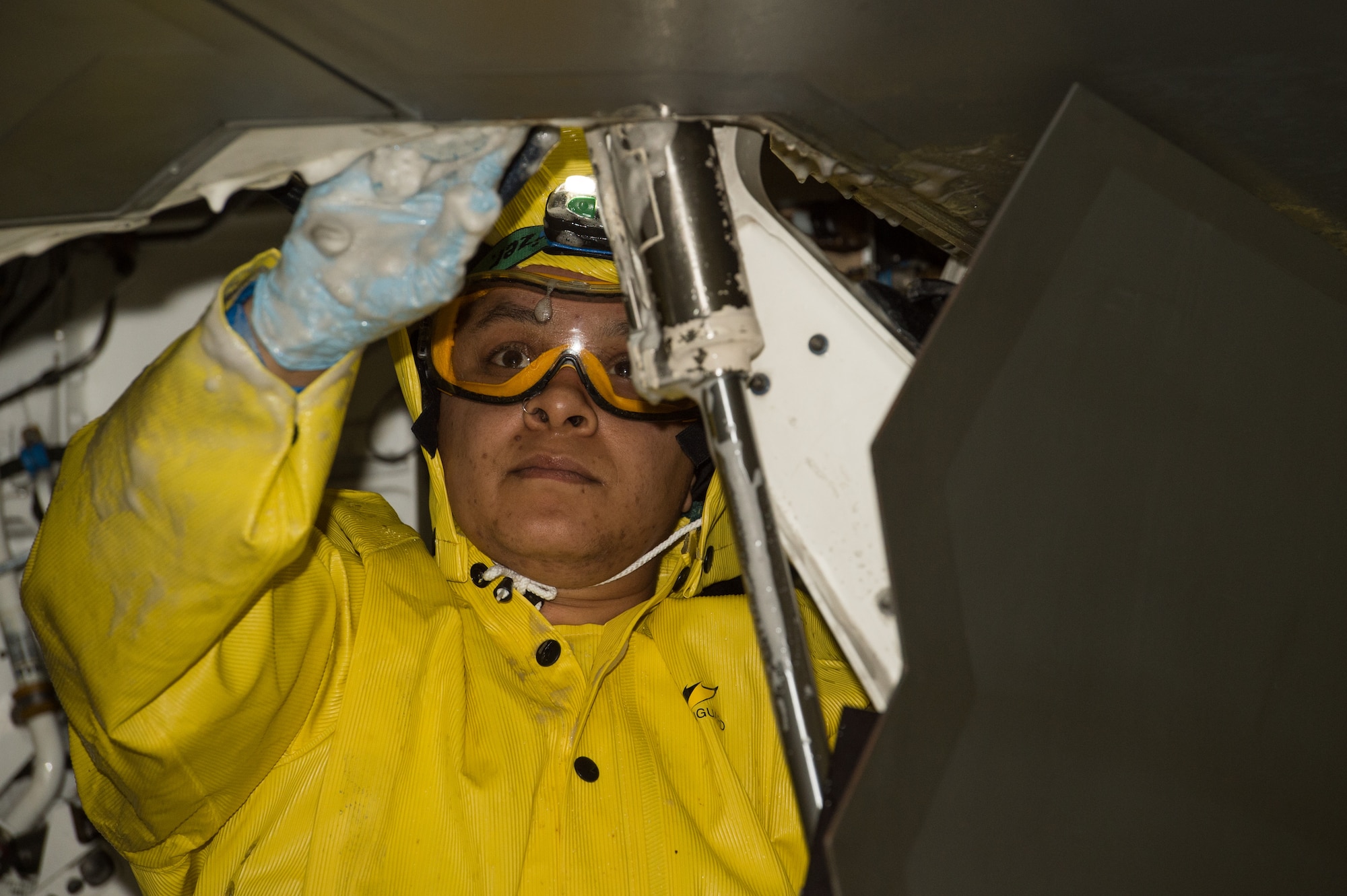 Lanese Holiday, Shiloh Services Incorporated aircraft wash contractor with the 1st Maintenance Group, washes a U.S. Air Force F-22 Raptor at Joint Base Langley-Eustis, Virginia, Dec 12, 2019.