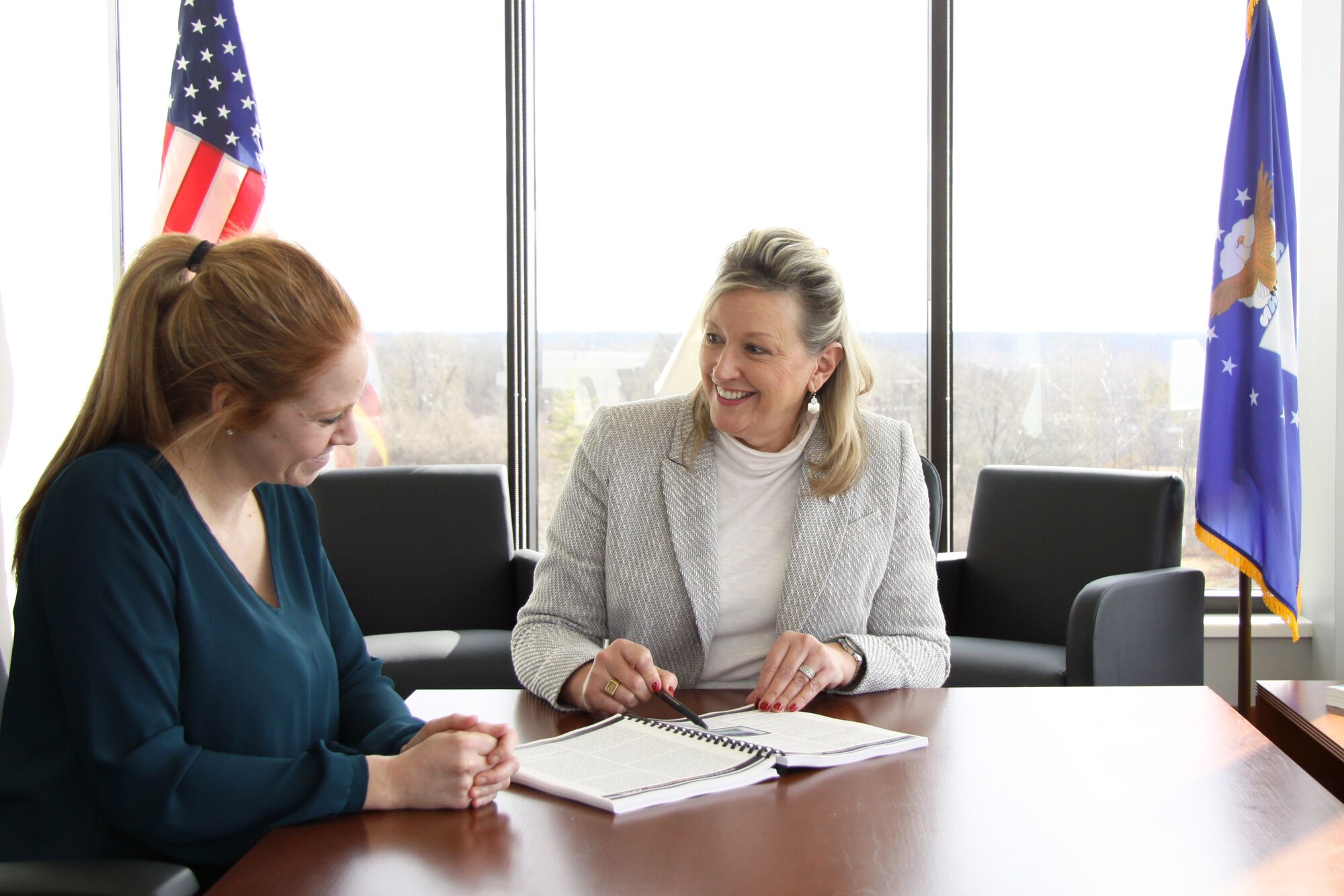 Jacqueline Janning-Lask, director, Air Force Research Laboratory Sensors Directorate, provides an overview of the directorate’s mission to Jodie Hunt, an executive assistant assigned to the Sensors Directorate, March 4, at Wright-Patterson Air Force Base, Dayton, Ohio. Janning-Lask, recently promoted to the director position, participated in immersion briefs throughout the directorate. (U.S. Air Force photo/Rachel Simones)