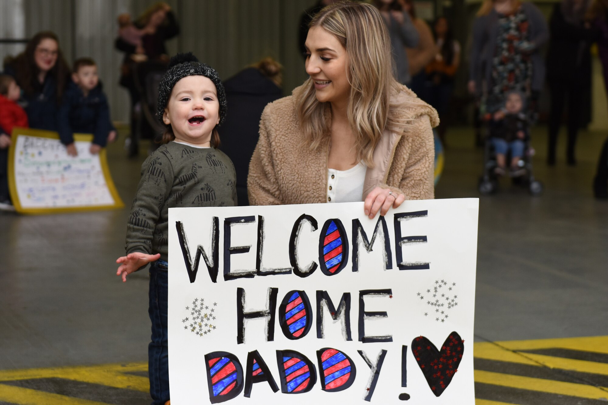 Friends and family welcome Airmen assigned to the 494th Fighter Squadron home from deployment at Royal Air Force Lakenheath, England, March 5, 2020. Airmen from the 48th Fighter Wing returned from a deployment supporting U.S. Air Force Central Command.  (U.S. Air Force photo by Airman 1st Class Jessi Monte)