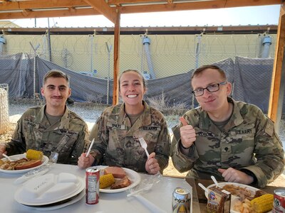 Spc. Austin Whaley, a human resources specialist, Sgt. Emily Shilts, an intelligence analyst, and Spc. Dylan Zdroik, a signal information sergeant with the Wisconsin Army National Guard’s 1st Battalion, 128th Infantry, enjoy a meal together in Afghanistan. The 1st Battalion, 128th Infantry deployed to Afghanistan in July 2019, and is acting as a “Guardian Angel” security element for the 3rd Security Force Assistance Brigade.