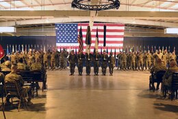 Soldiers of the 3rd Medical Command - Deployment Support (right) and the 8th Medical Brigade (left) stand in their respective formations during their transfer of authority ceremony at Camp As Sayliyah, Qatar, July 18, 2019. (Courtesy photo)