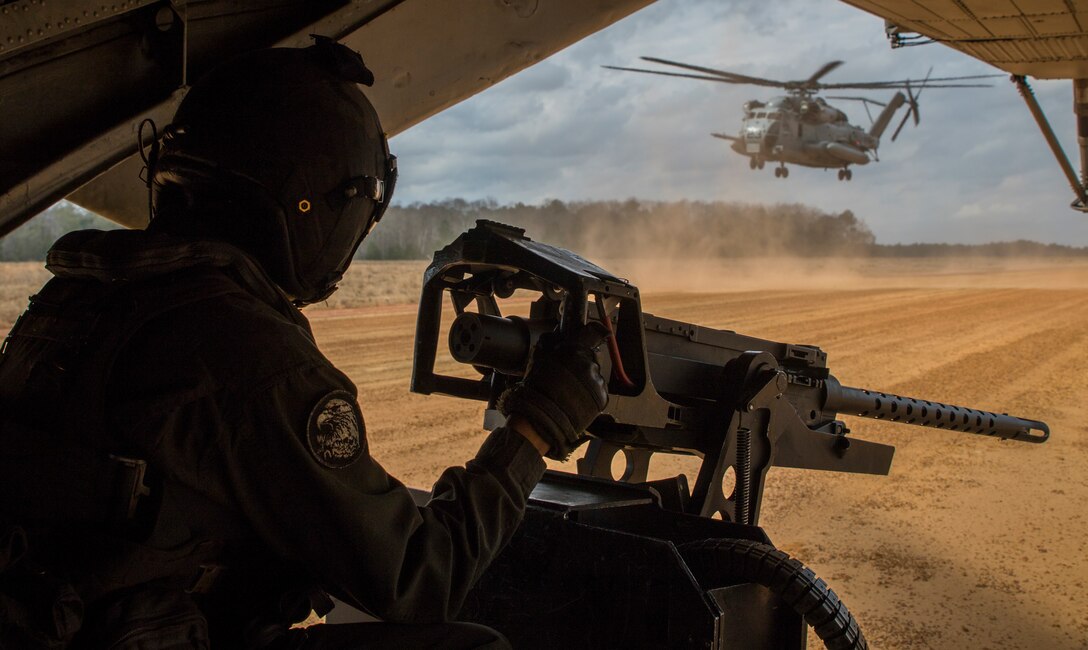 A U.S. Marine sits on the ramp of a CH-53E Super Stallion after landing during a deployment for training in Savannah, Georgia, Feb. 5.