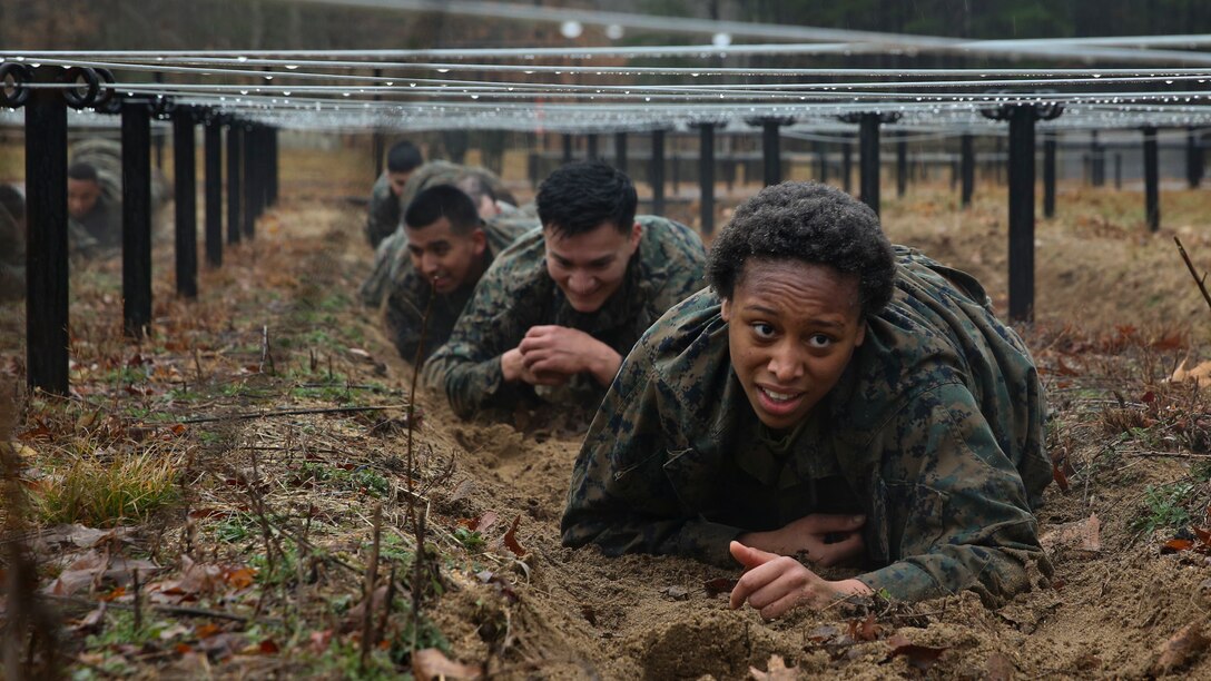 U.S. Marines from Corporals Course 615-20 with Combat Instructor Battalion go through the NATO standardized obstacle course at Marine Corps Base Quantico, Va., Feb. 13.