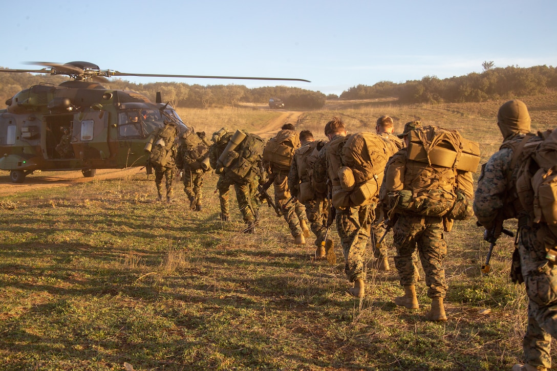 U.S. and Hellenic Marines load into an NH90 Tactical Transport Helicopter during Exercise Alexander the Great 2020 in Volos, Greece, Feb. 2.